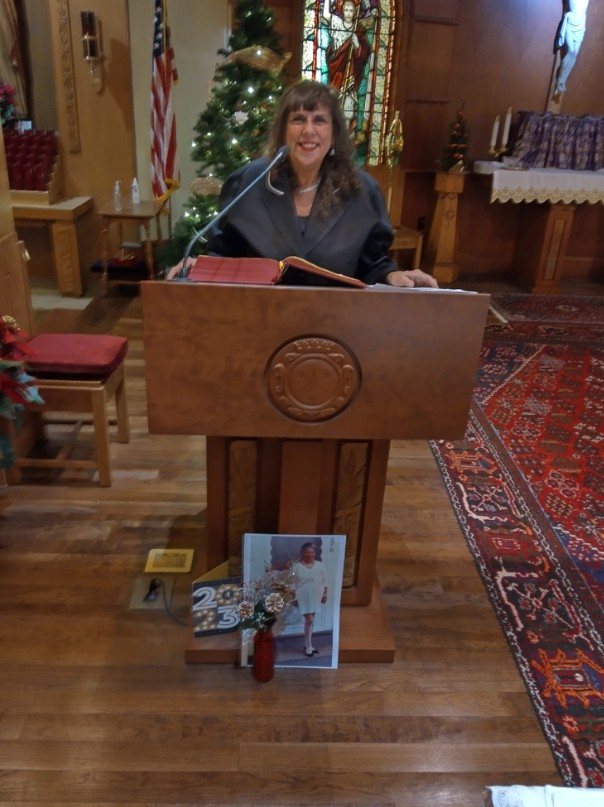 Rosemarie at the lectern reading Scripture